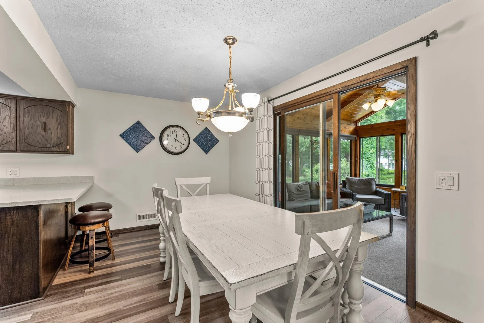 Dining room leads to three-season porch