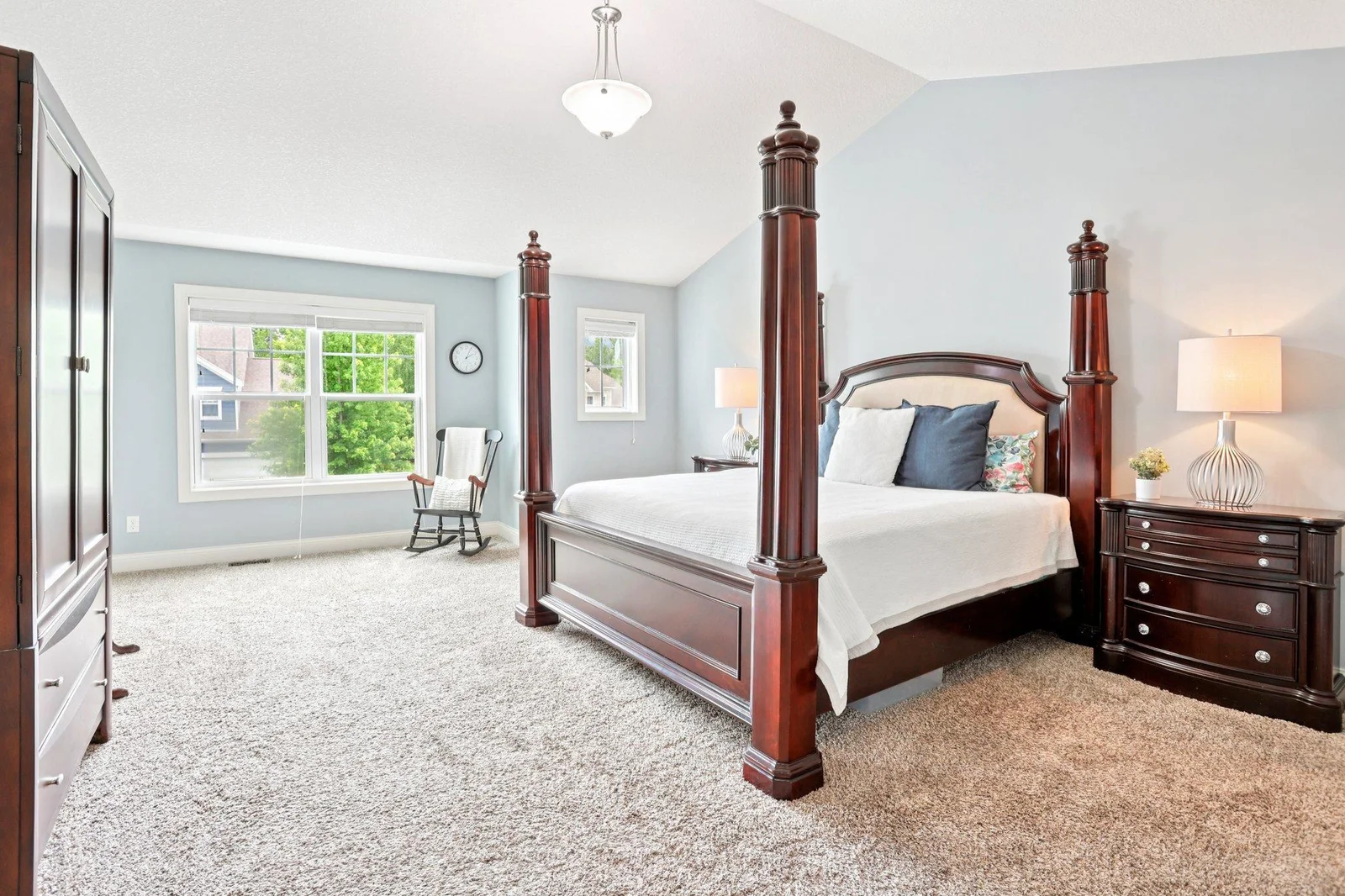 Charming primary suite with vaulted ceilings and bathed in natural light.