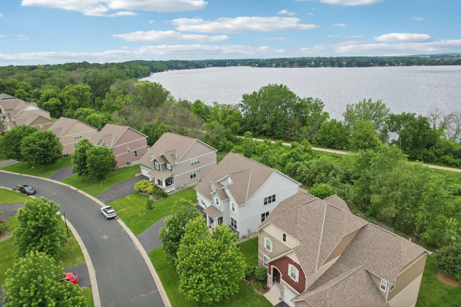 Lush landscaping enhances privacy and curb appeal.