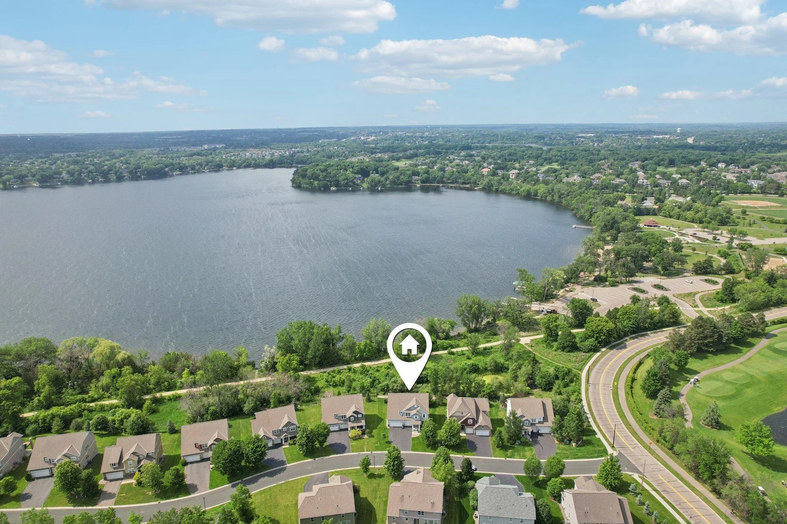 Incredible location backing directly to Lake Riley with picturesque water views.