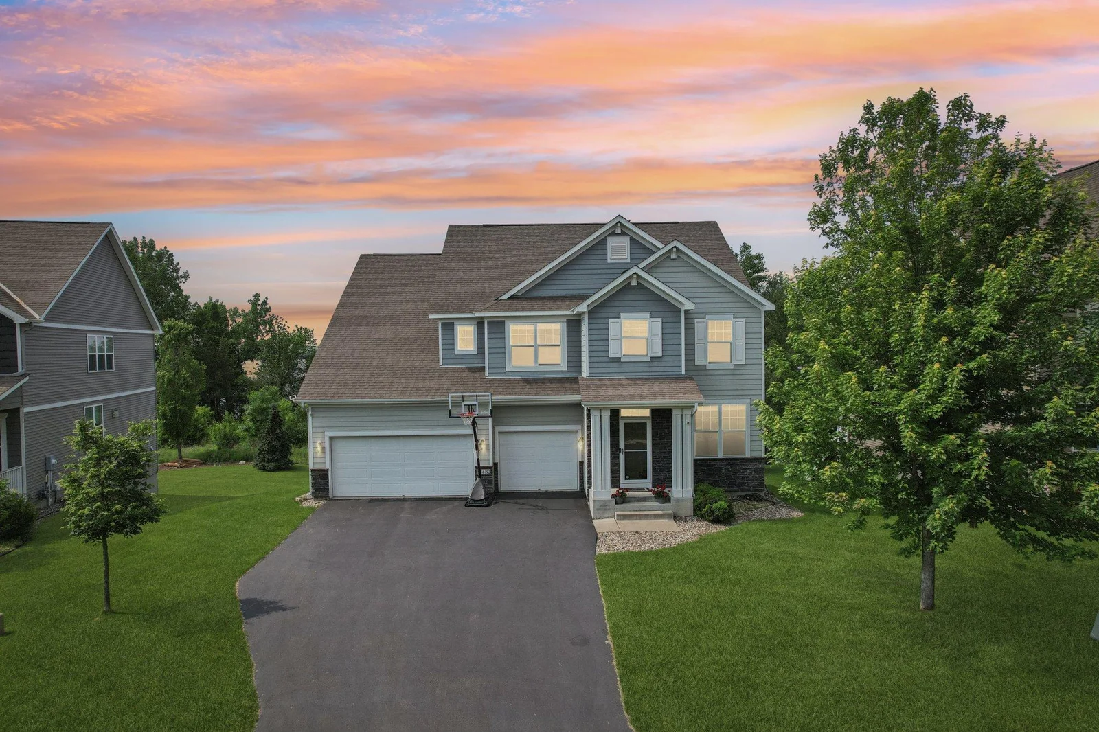 This beautifully updated two-story walkout offers luxury, flexibility, and breathtaking views of Lake Riley.