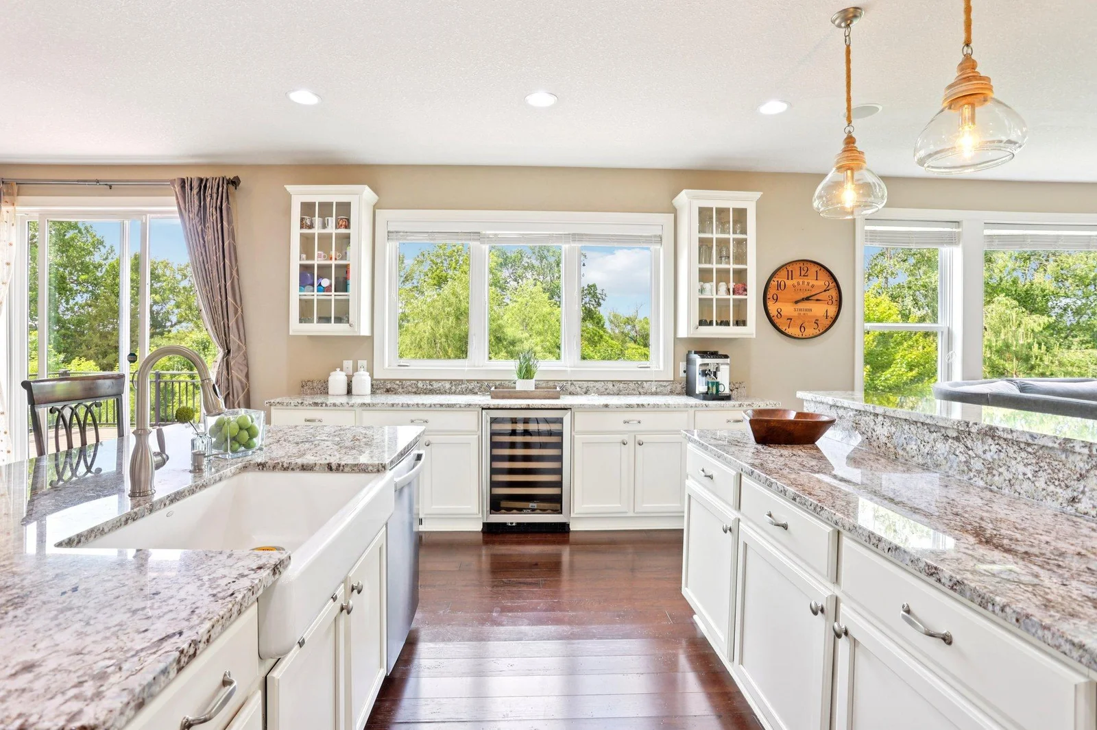 Expansive windows flood the home with natural light and frame stunning lake views.
