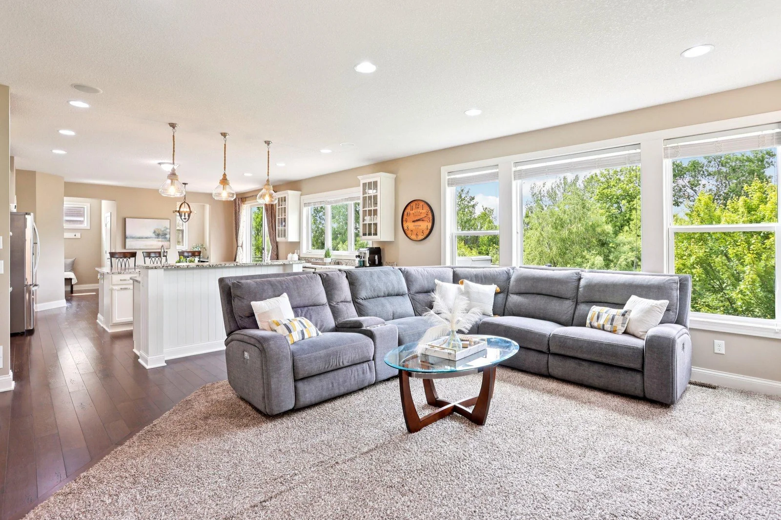 Bathed in natural light from oversized windows, this space is perfect for relaxing, entertaining, or simply soaking in the serene surroundings.