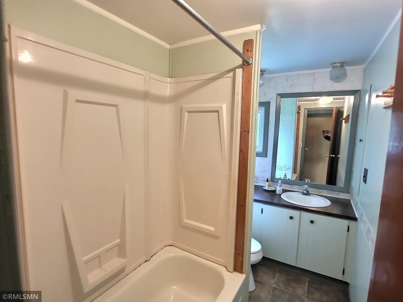 The 2nd bathroom is located conveniently between the two extra bedrooms.