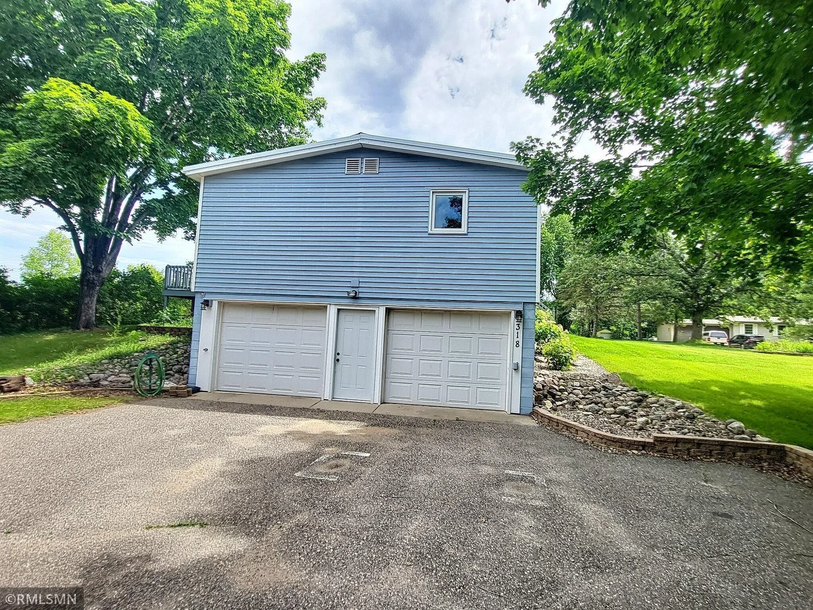 Here is a view of the side of the home.  The garage is 24 x 32 approximately and is extended for extra vehicles or work shop area.