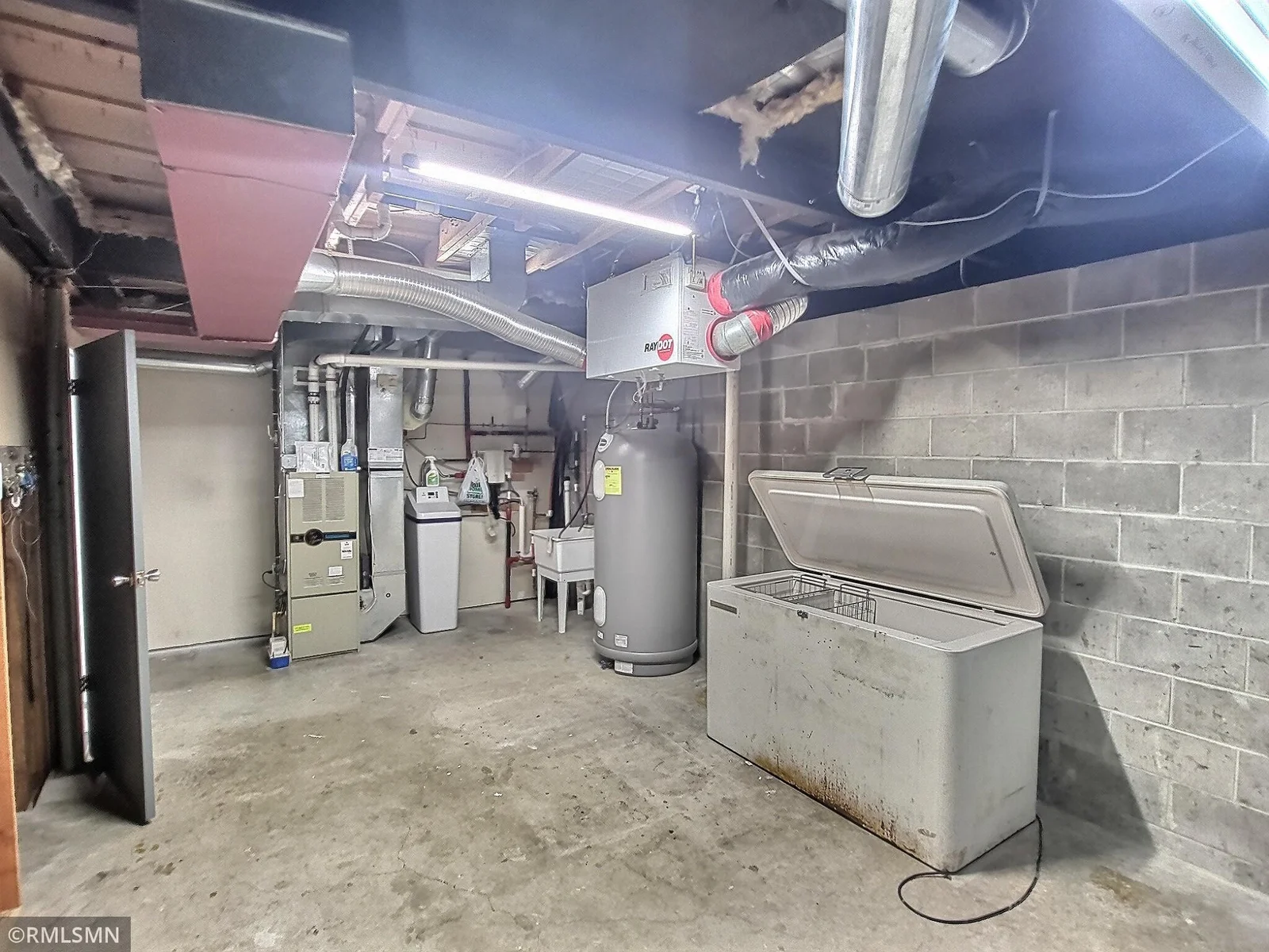 The large lower level utility room has plenty room for storage.  Freezer works great!
