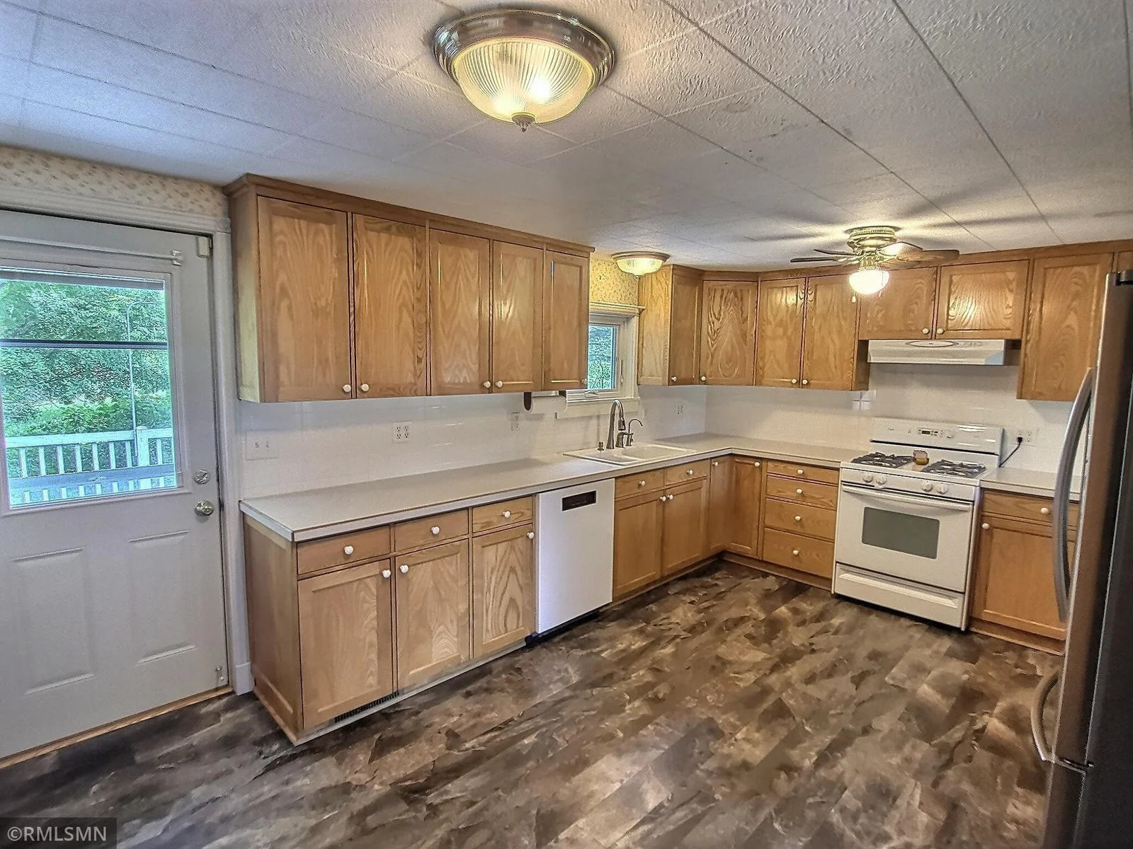Another view of the kitchen and walk out to the deck.