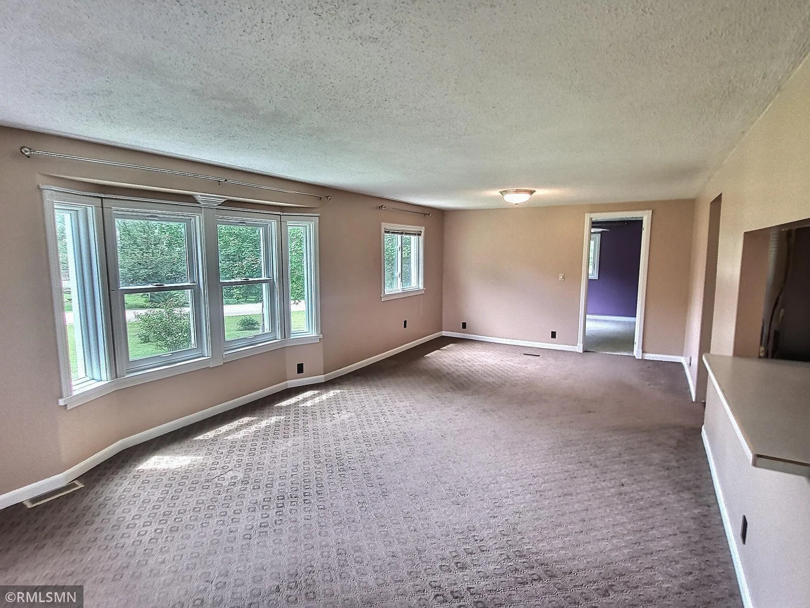 Living area is very spacious with lots of natural lighting.  Plenty of space for friends and family to hang out.