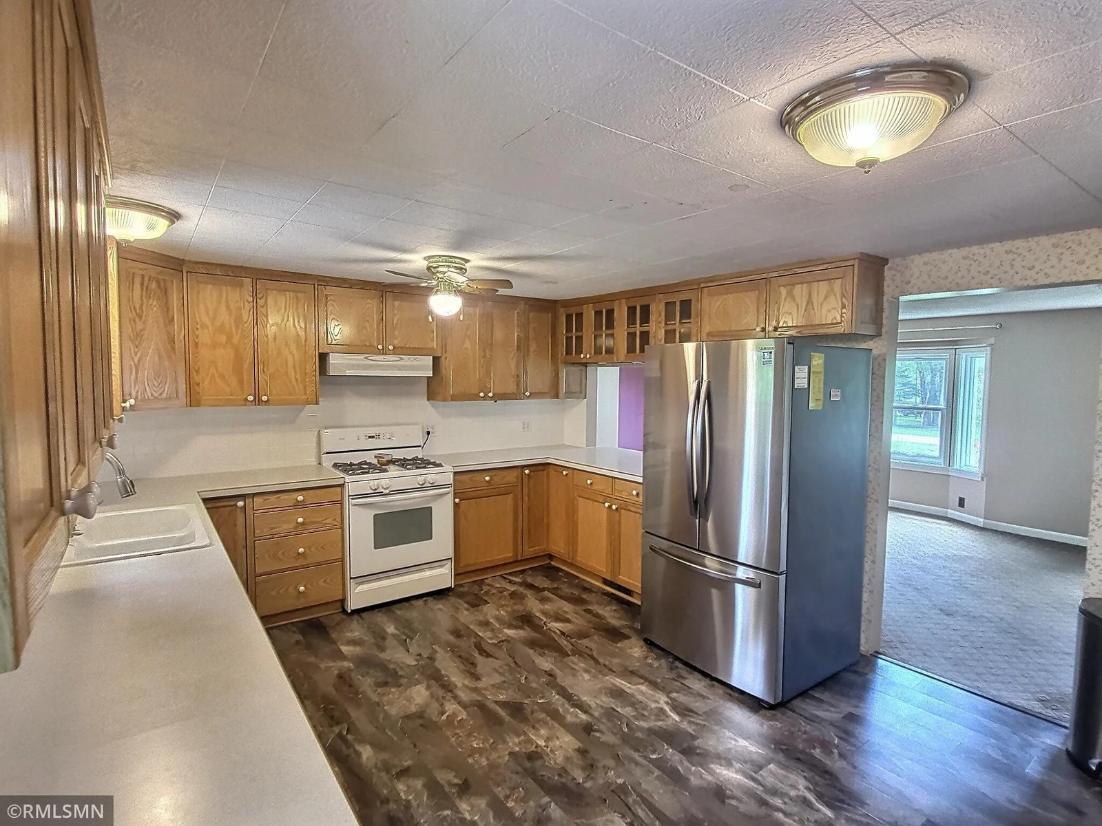 Another view of the kitchen with lots of counter space, kitchen window and pass through window.  Great for entertaining!