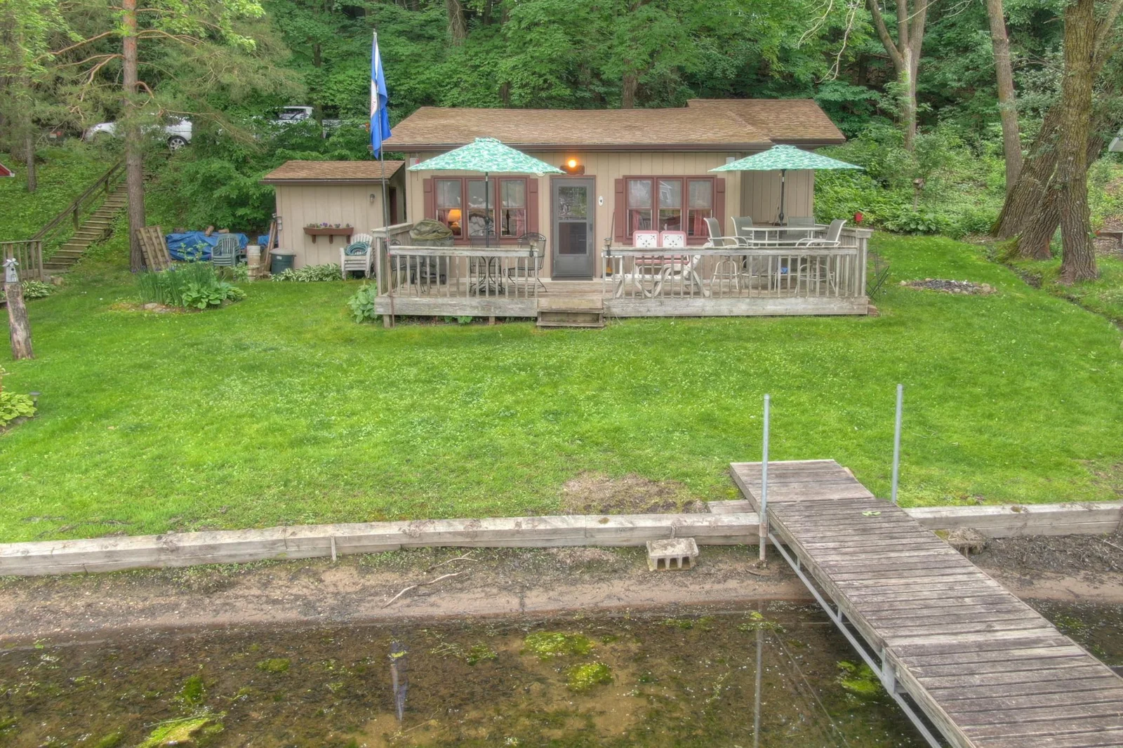 This well maintained seasonal cabin is ready to enjoy and sits on waters edge. With 65 feet of level hard bottom lakeshore on Lake Augusta.