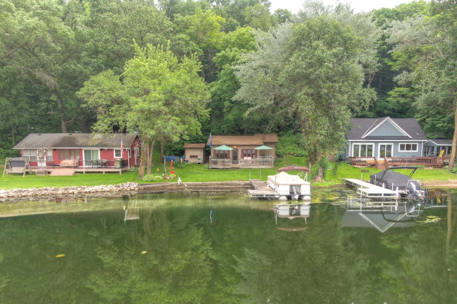 A view from the lake. This cute cabin comes furnished is ready to enjoy lake. Roof and Well pump are only 5yrs old.