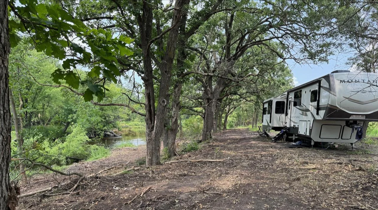 26.47 Acres, 2,200+ feet of Platte River Shoreline, 4 zoning classifications. Picture in Zone 3/4 border. Northern view of the Platter River, all cleared and ready for you.