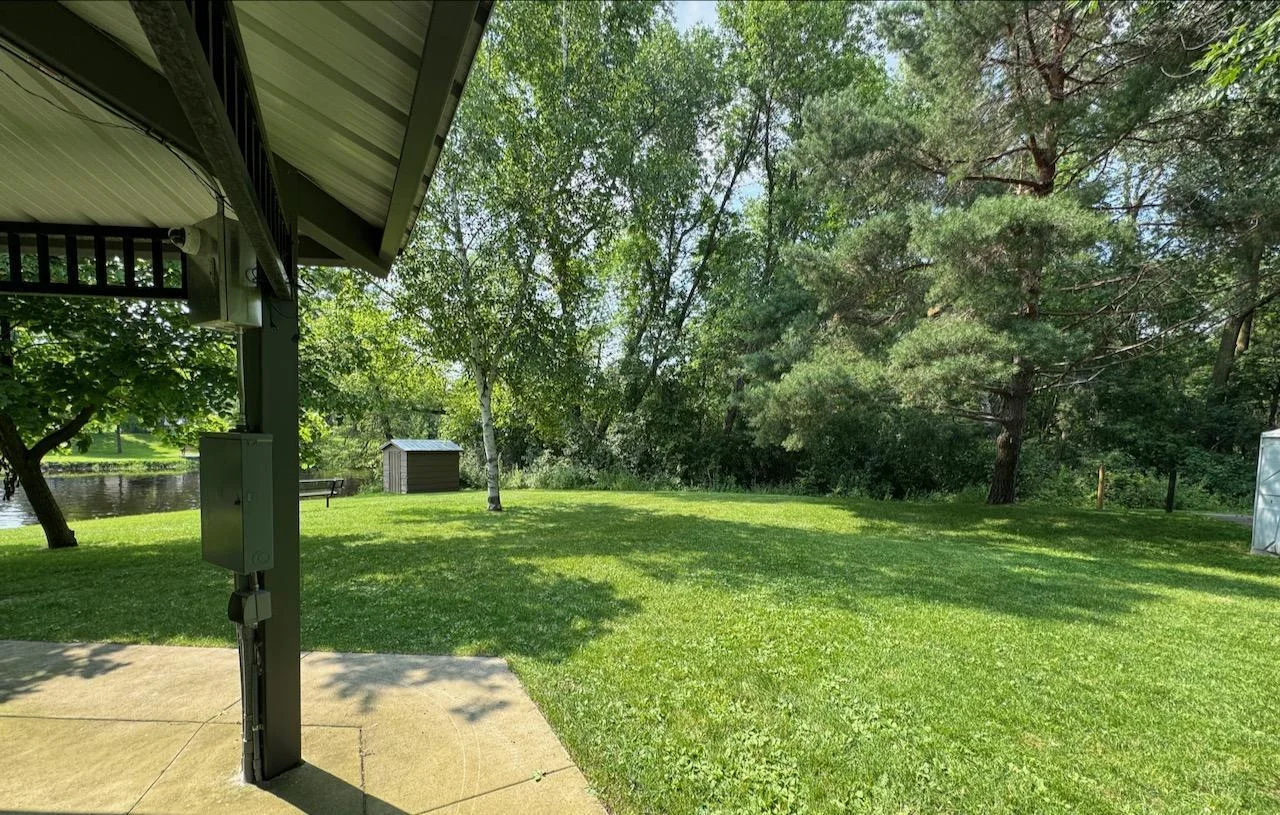 According to MLS map boundary, Zone 1 borders the city parks gazebo. Zoned Multi Family