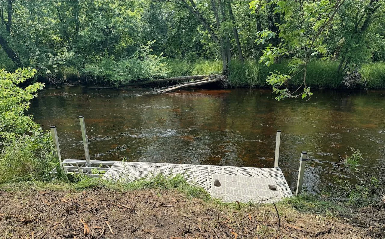 Ultimate privacy on over 2,200 feet of Platte River Shoreline. Dock faces an un-named island for complete privacy.