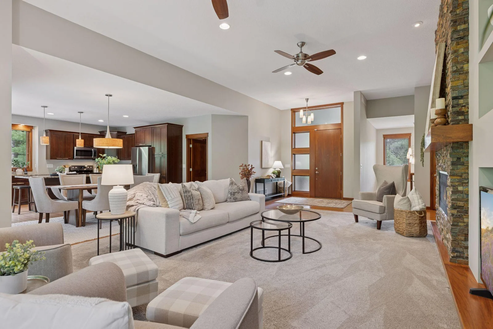 The open sightlines from the living room into the kitchen make everyday living seamless.