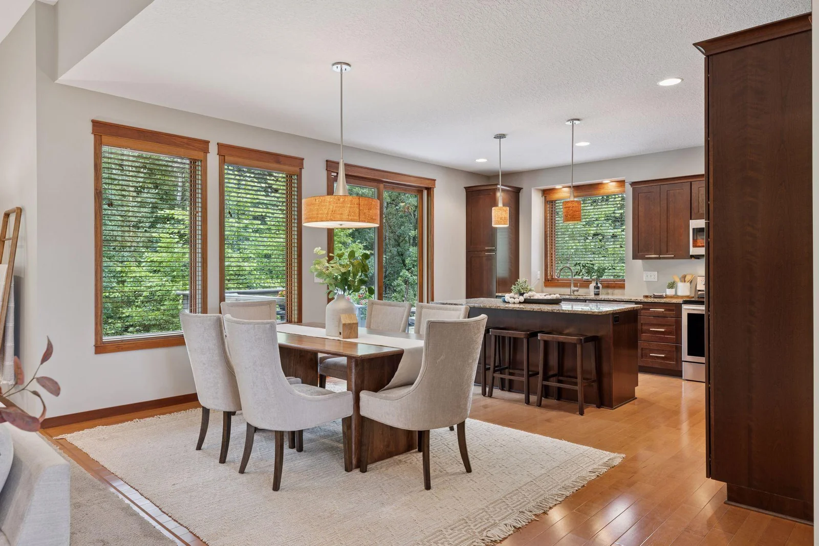 Light pours into the dining area and kitchen—designed with entertaining and daily life in mind.
