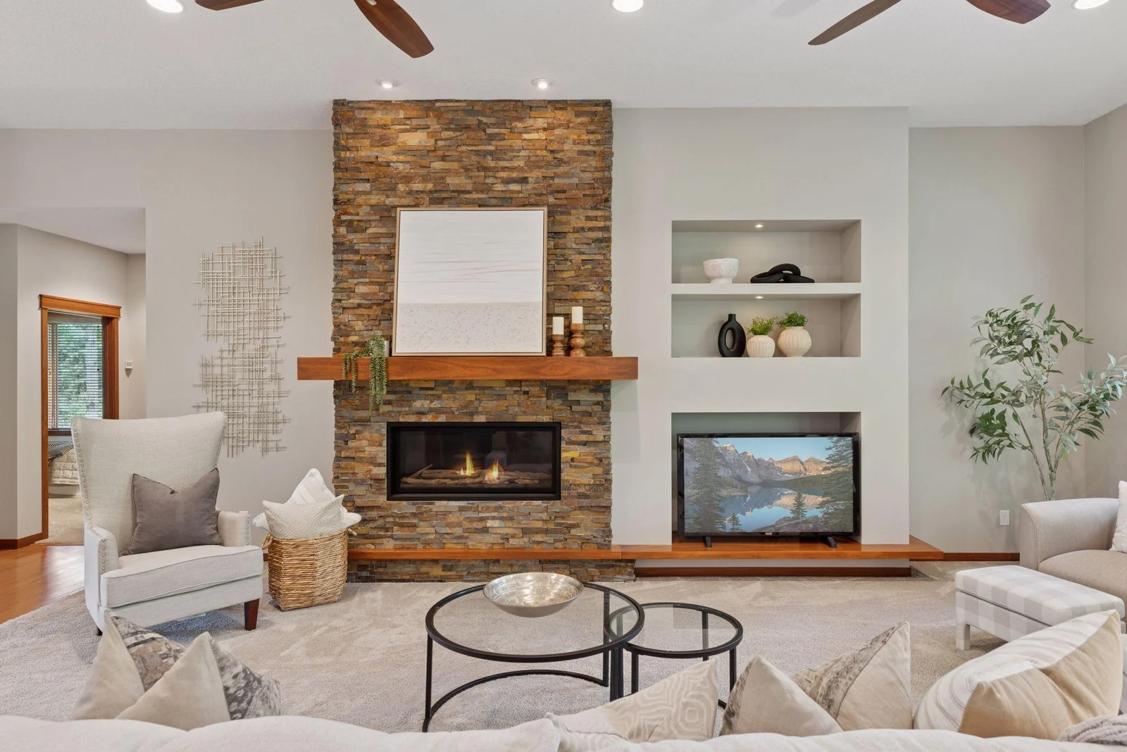 Stonework and custom built-ins blend functionality with timeless design in the main living space.