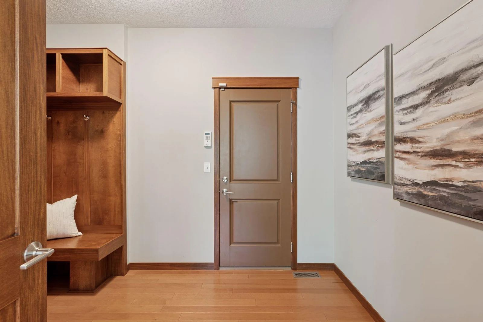 The main floor mudroom is plumbed for laundry if desired—flexible and functional.