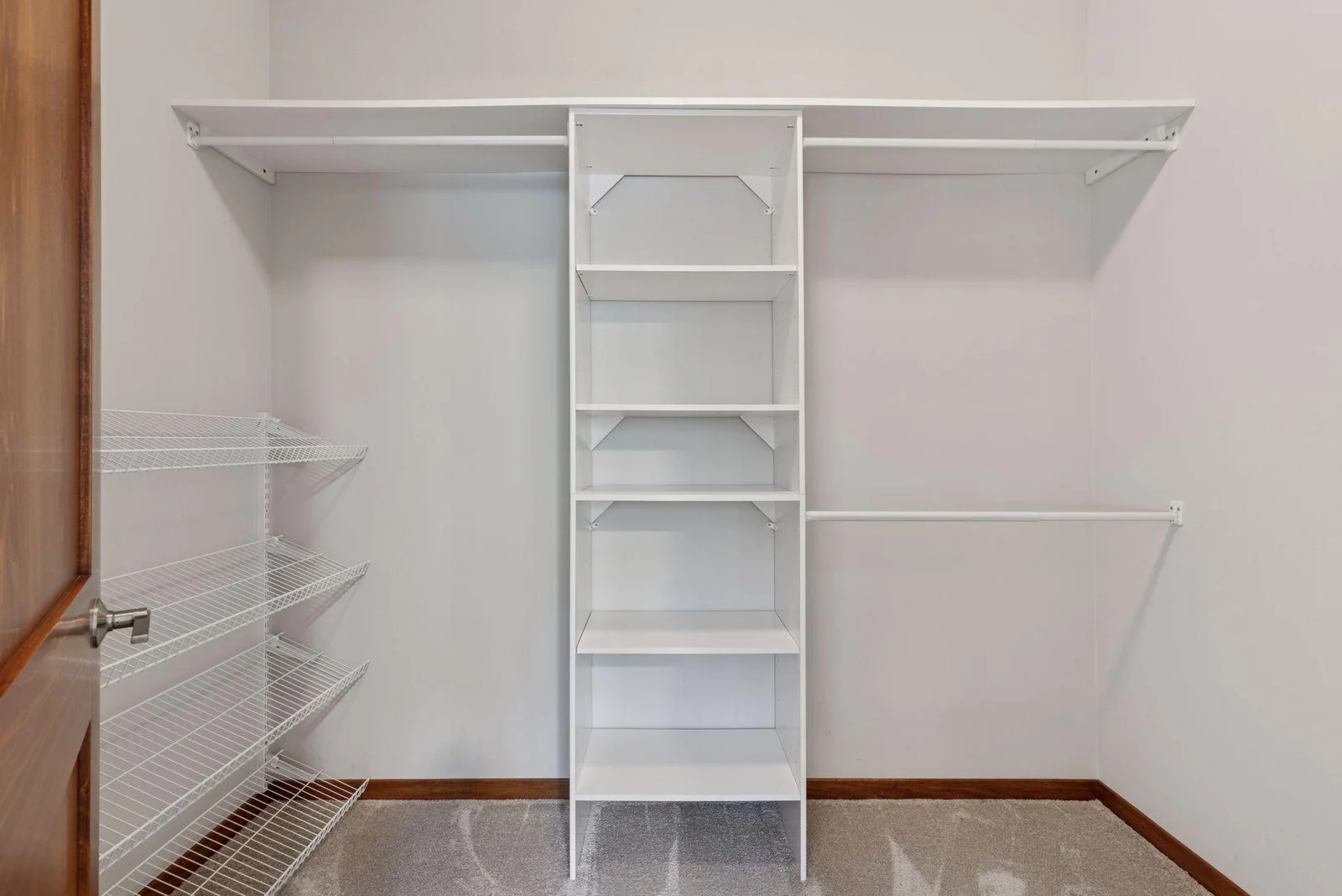 Custom closet systems add organization and ease in the primary suite.