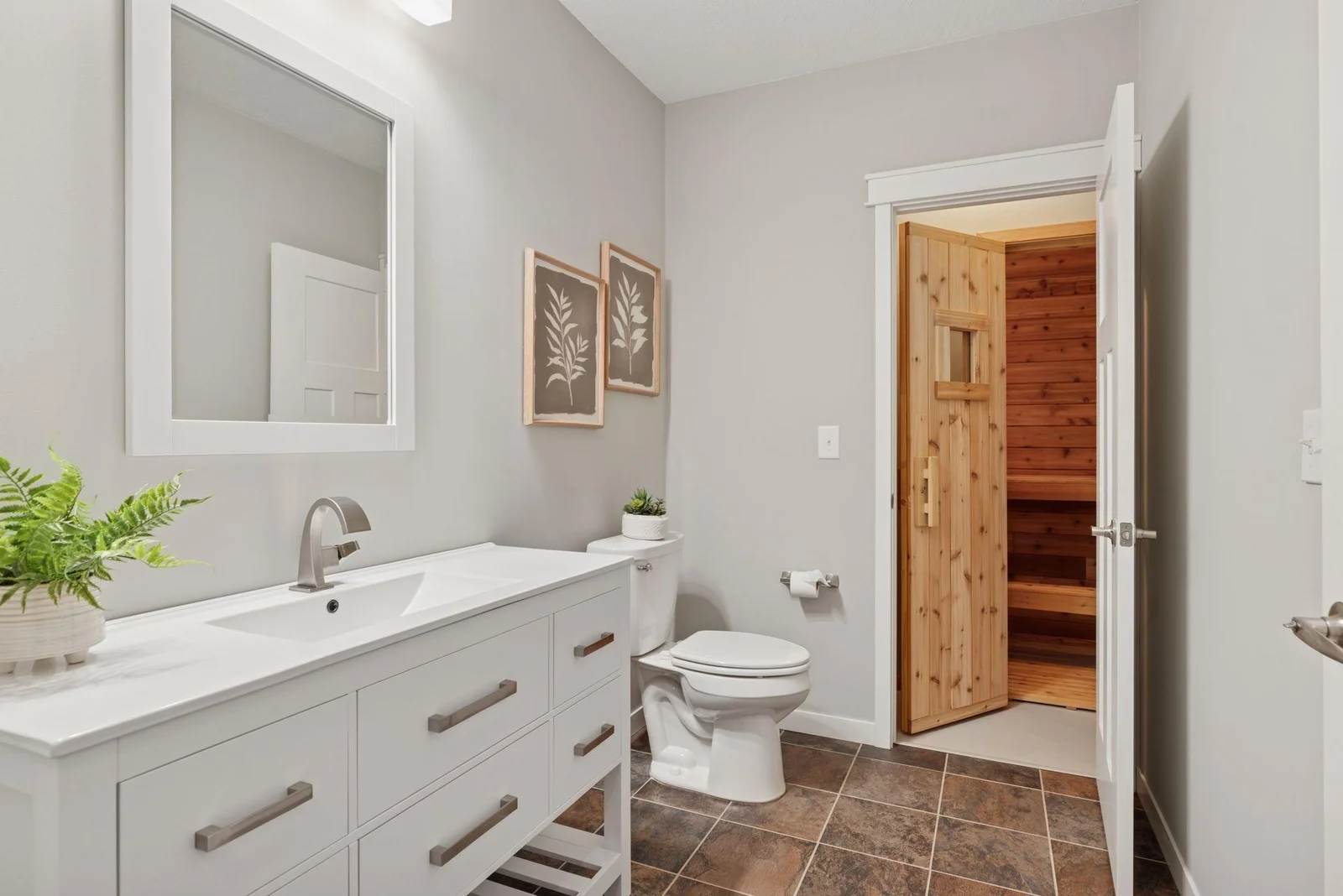 Lower level ¾ bath with walk-in shower and access to the sauna.