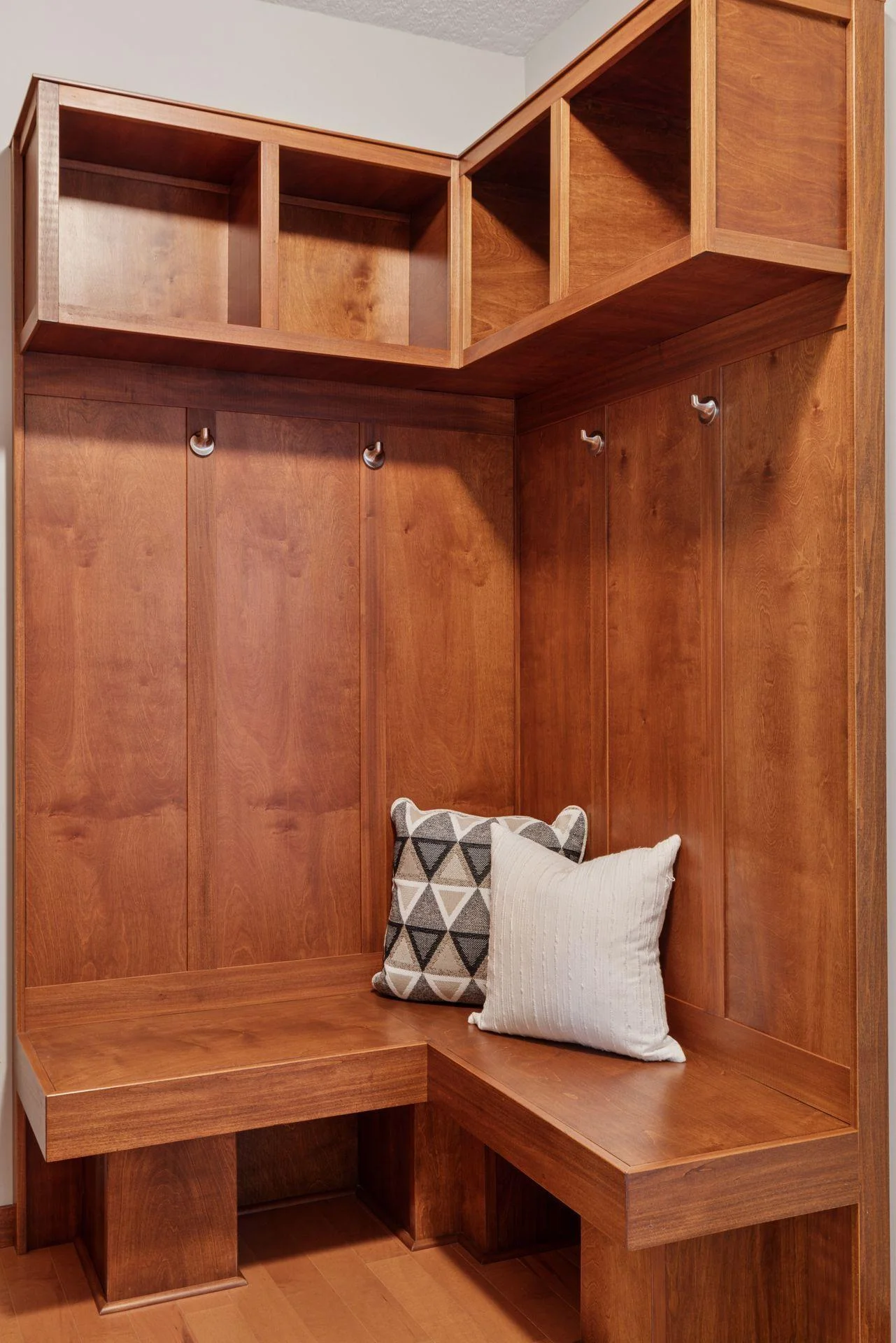Custom cabinetry and clean finishes add extra storage and style to the mudroom.