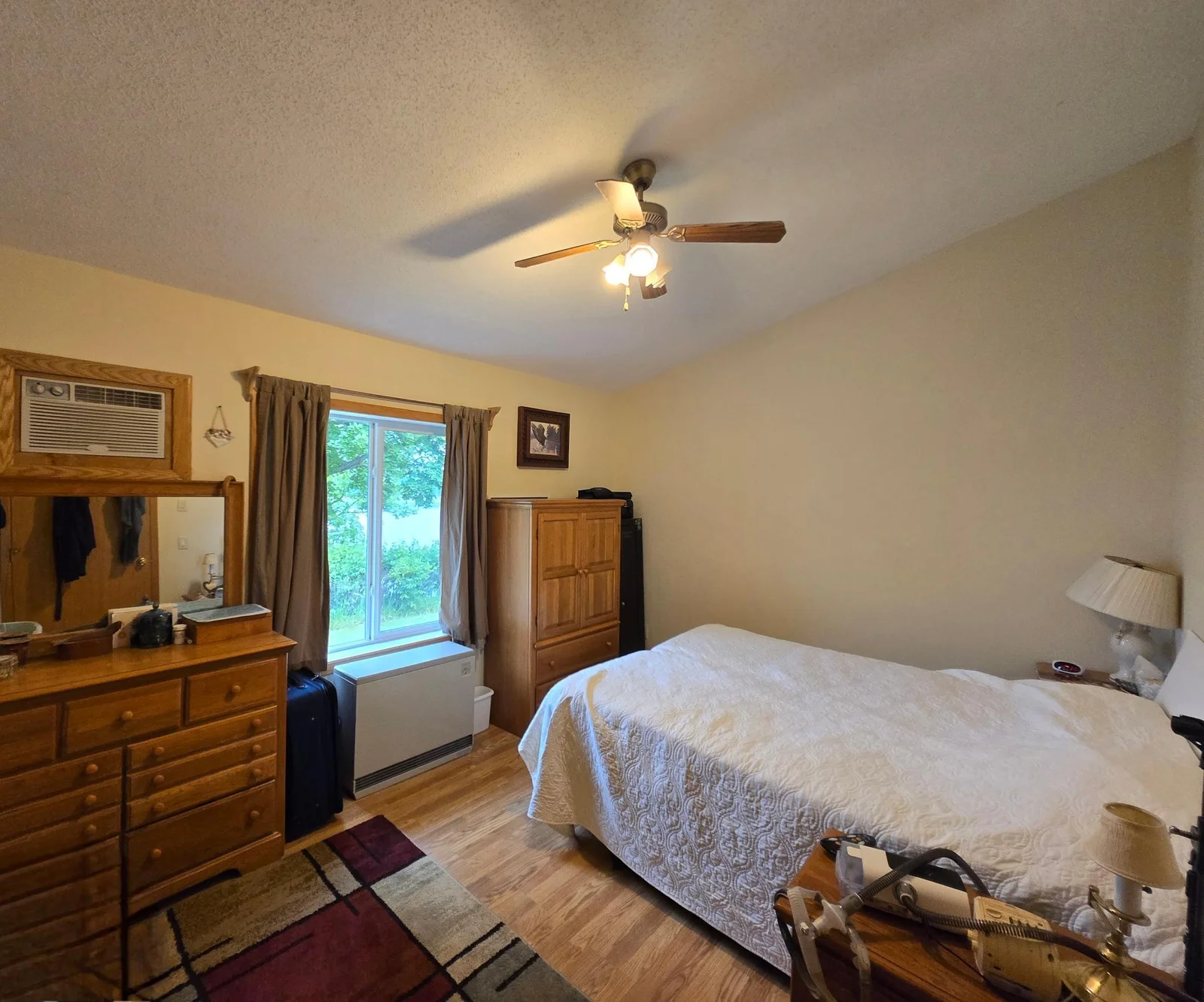 Bedroom 1 w/lake view, vaulted ceilings
