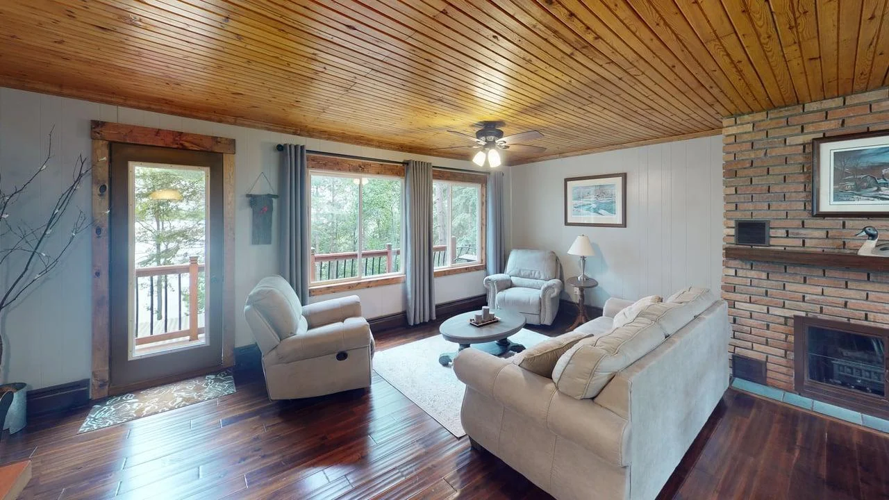 Living room w/access to deck & stunning lake views