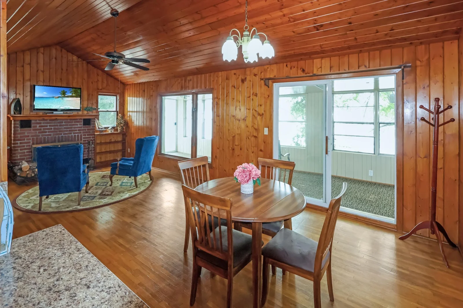Lakeside cabin- open dining to living room area with a porch..jpg