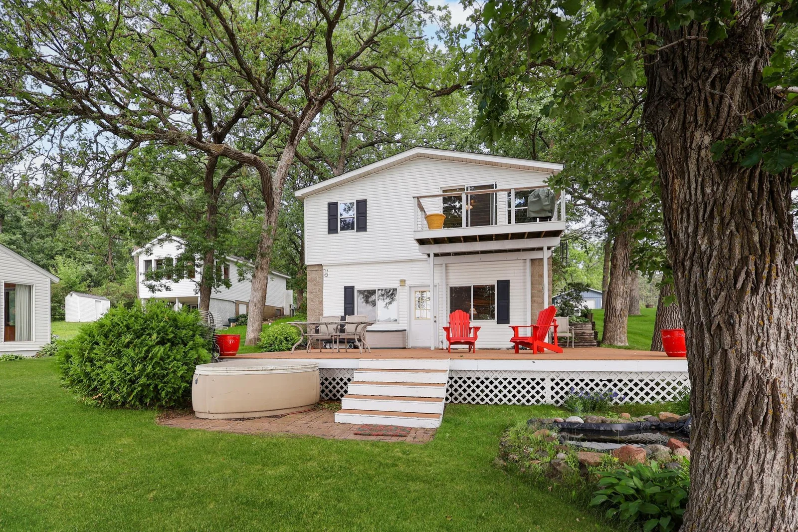 Main house- huge patio area waiting for you to enjoy the summer views!.jpg