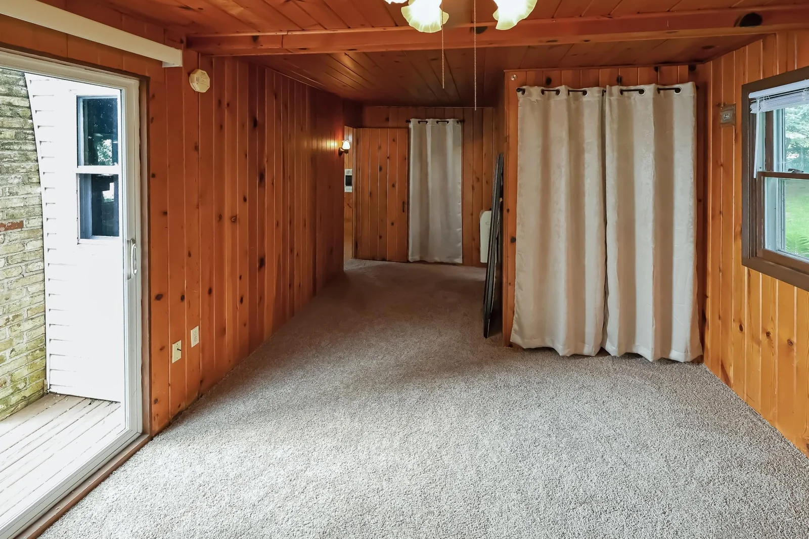 Lakside cabin- bedroom with lakeside patio door..jpg