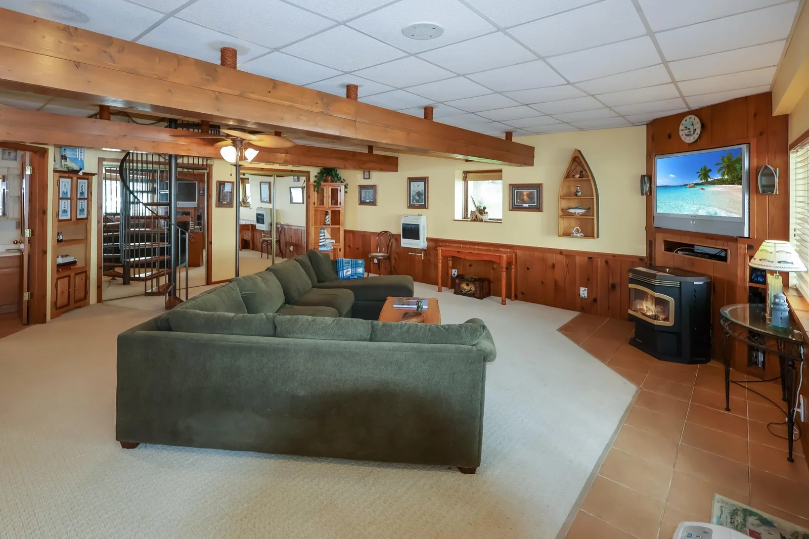 Main house- lower level family room with a pellet stove and additional sitting area..jpg