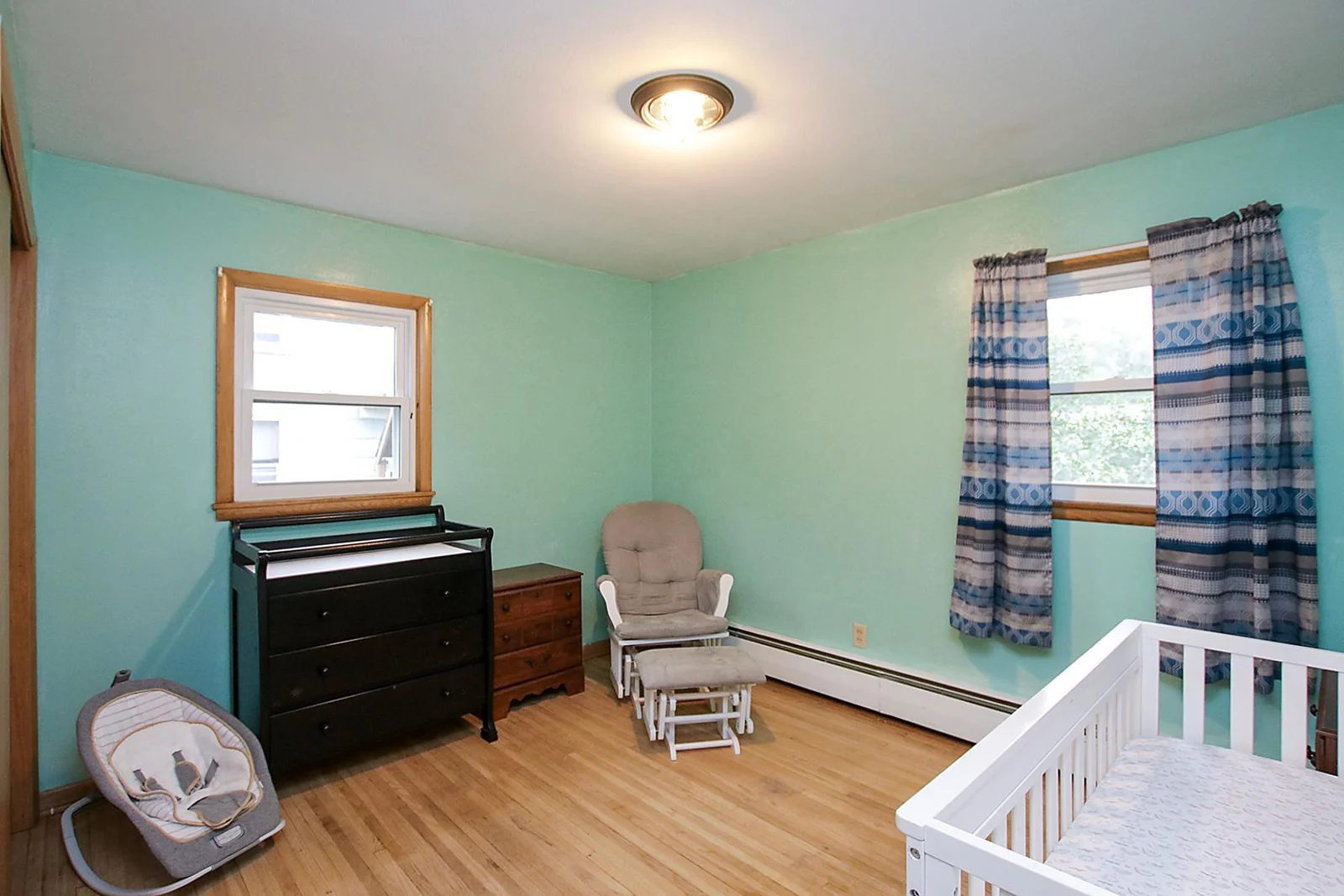 Second bedroom is bright and airy with hardwood floors as well!