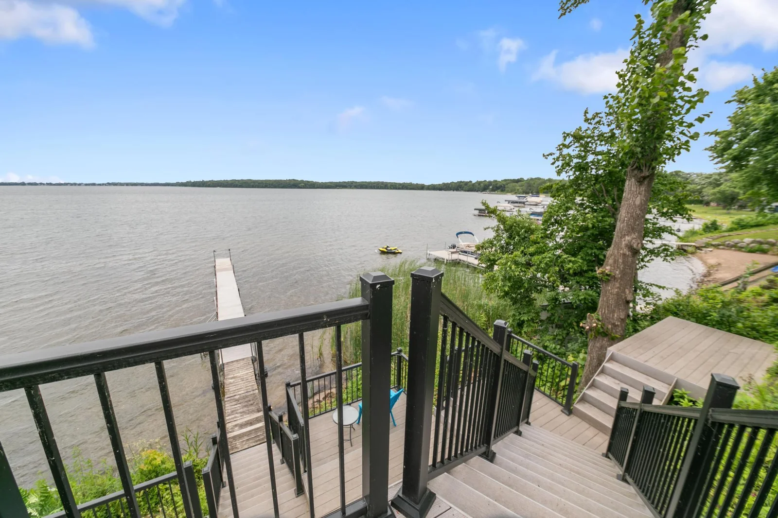 Uninterrupted views make this  lakeside elegance a great place to enjoy your favorite refreshment