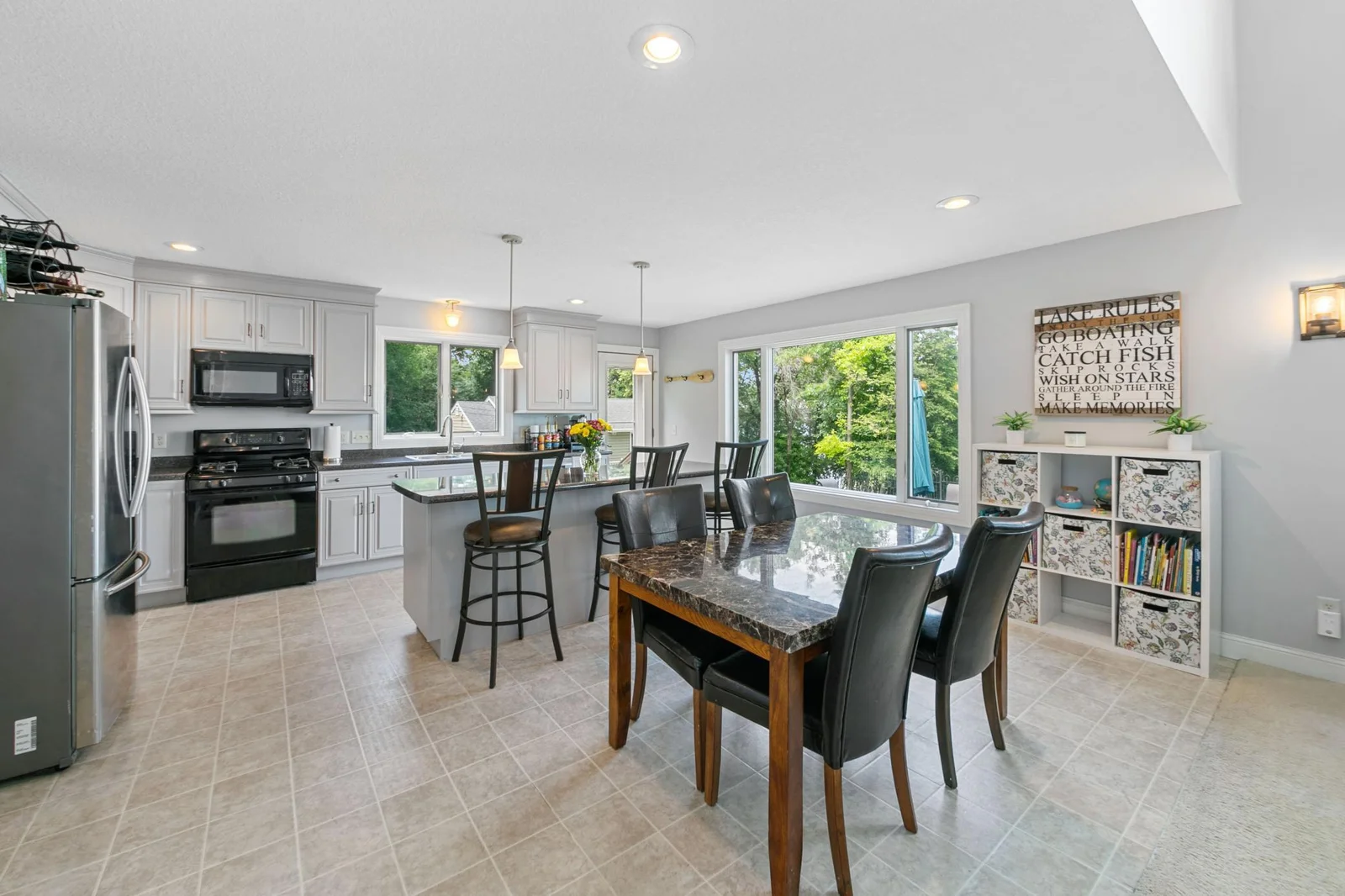 The main level blends the kitchen, dining, and living areas into a light-filled open plan c