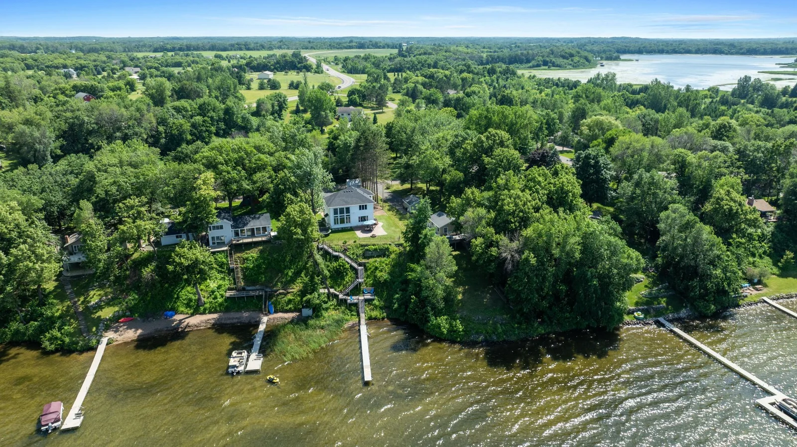 Nestled on the water’s edge, this home features a private dock and panoramic lake views ideal for morning paddles or evening sunsets.