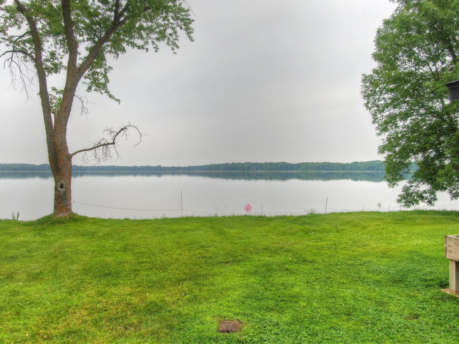 Can you imagine having this tranquil view looking out over Lake John every day? Properties like this do not come for sale very often. Don't miss out on your chance to own this great property!