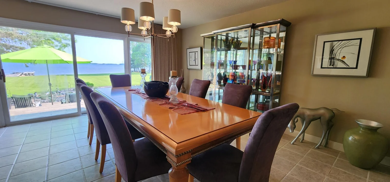 Dining room with walkout to patio facing the lake