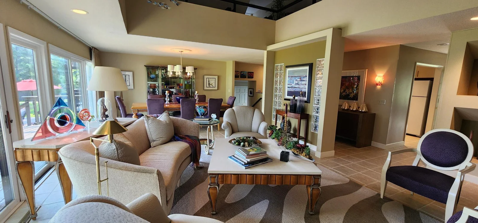 Living room with wall to ceiling windows