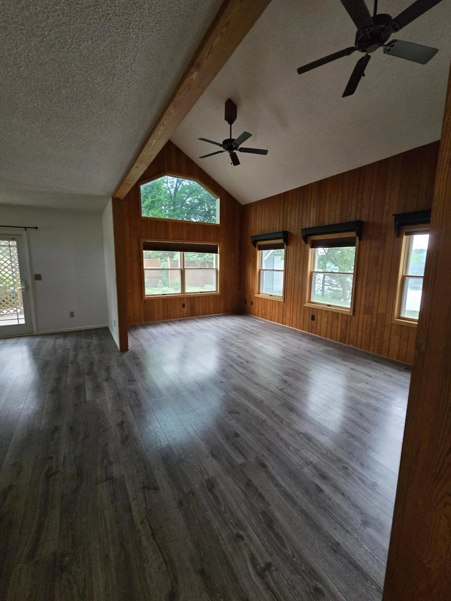 High vaulted ceilings and the wall of windows makes for so much natural light in the living room