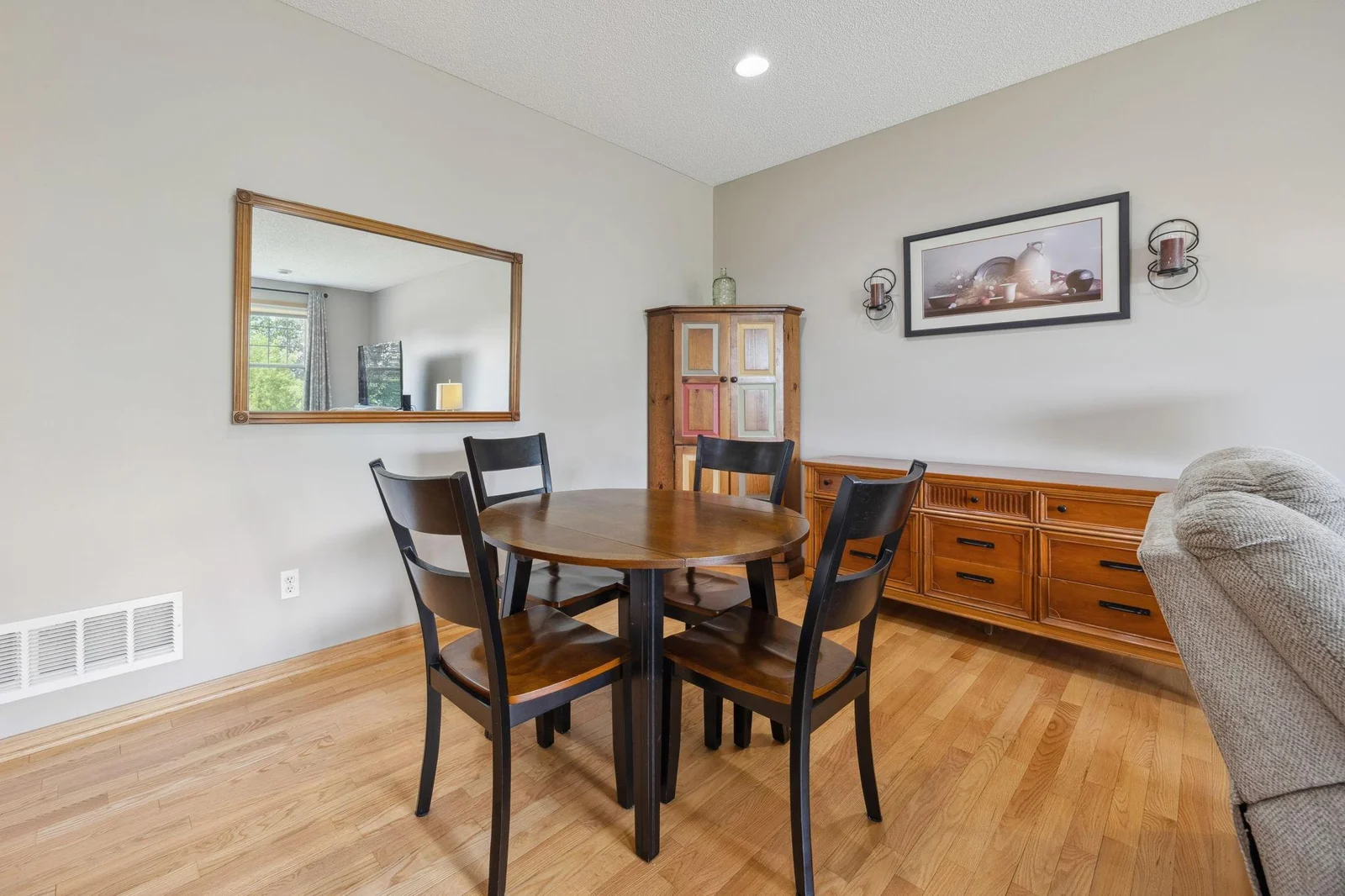 Informal dining steps from kitchen and living room. Enjoy your views out your wall of windows.