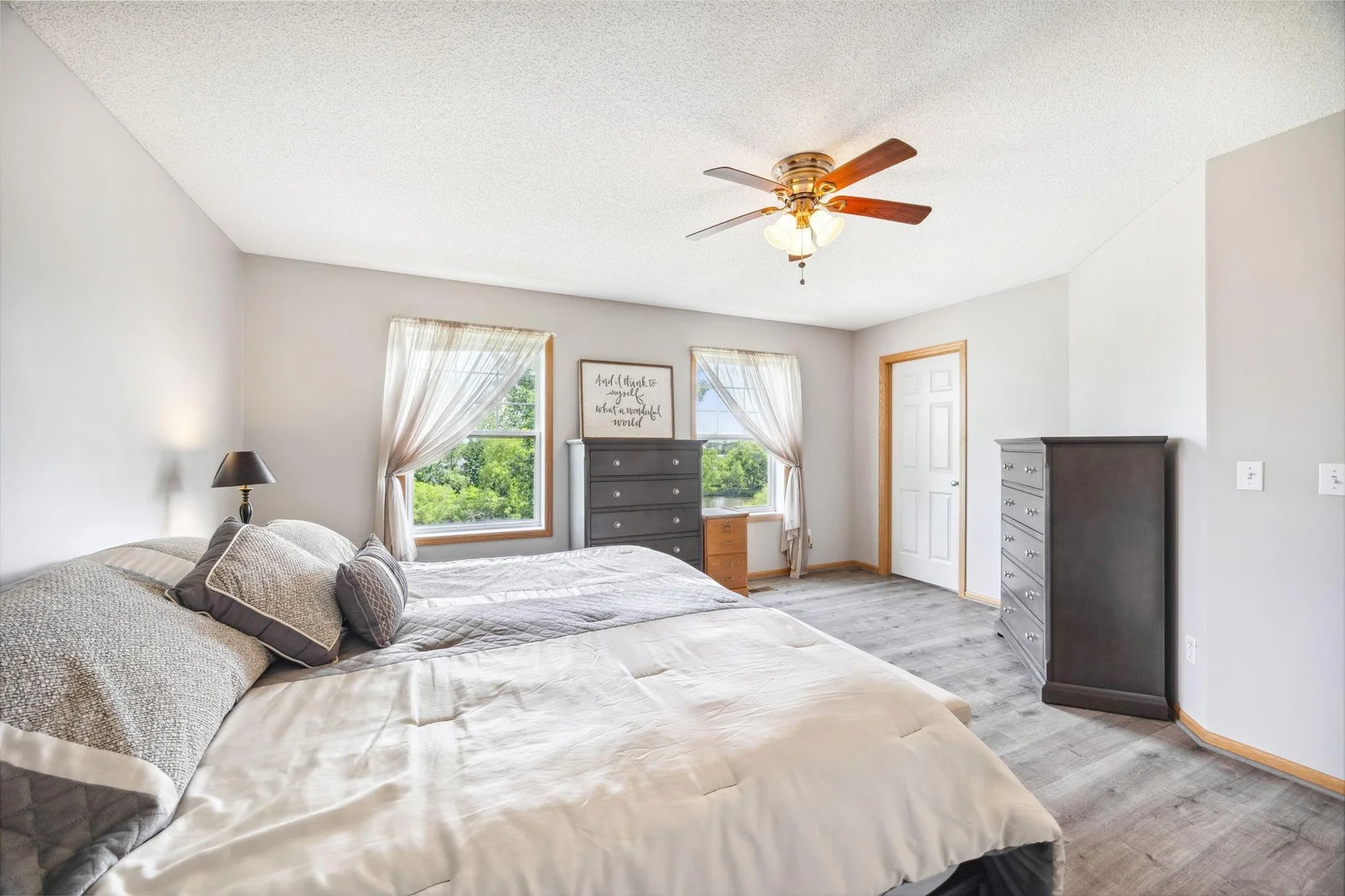 Primary bedroom w/ LARGE walk in closet. Ceiling fans definitely a plus in the bedrooms.