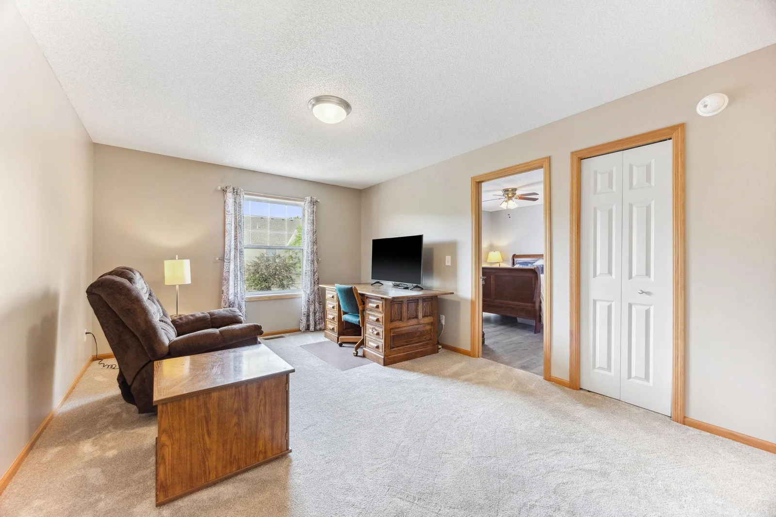 Loft w/ secondary bedroom view. Comfy carpet on the feet and stylish flooring in both bedrooms.