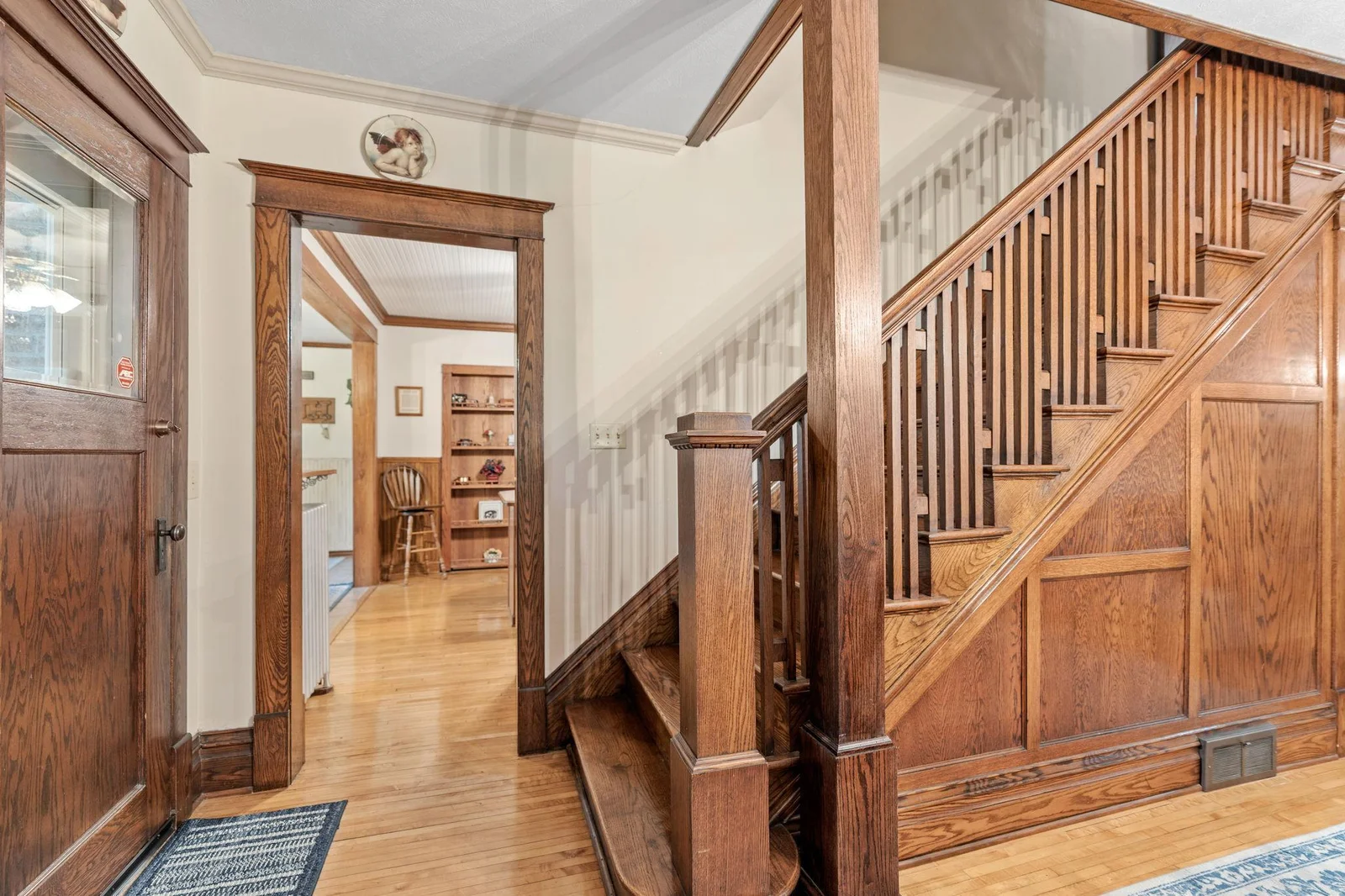 Beautiful staircase-featuring original woodwork.