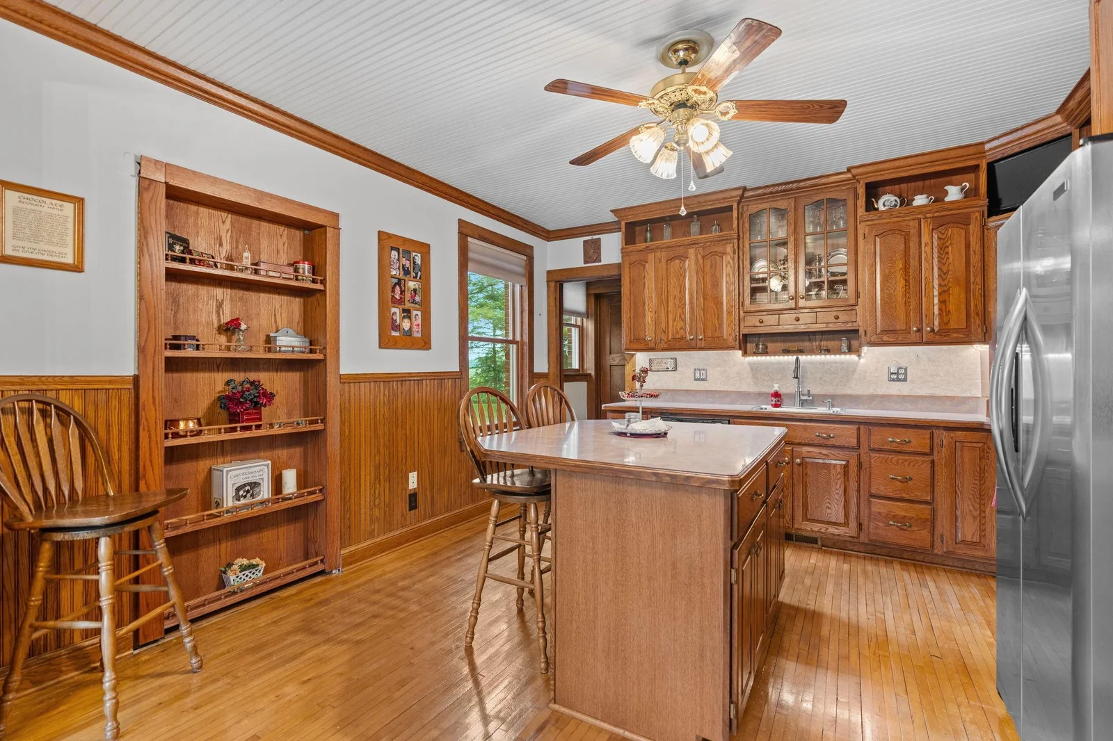 Build in shelf leads to a hidden Butler's pantry.
