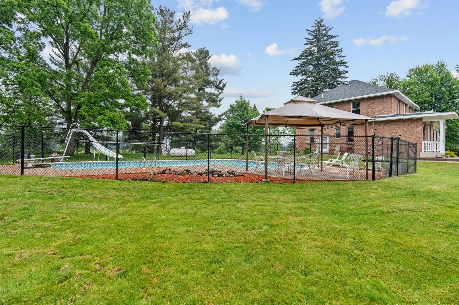 Fencing surrounding the in-ground pool.