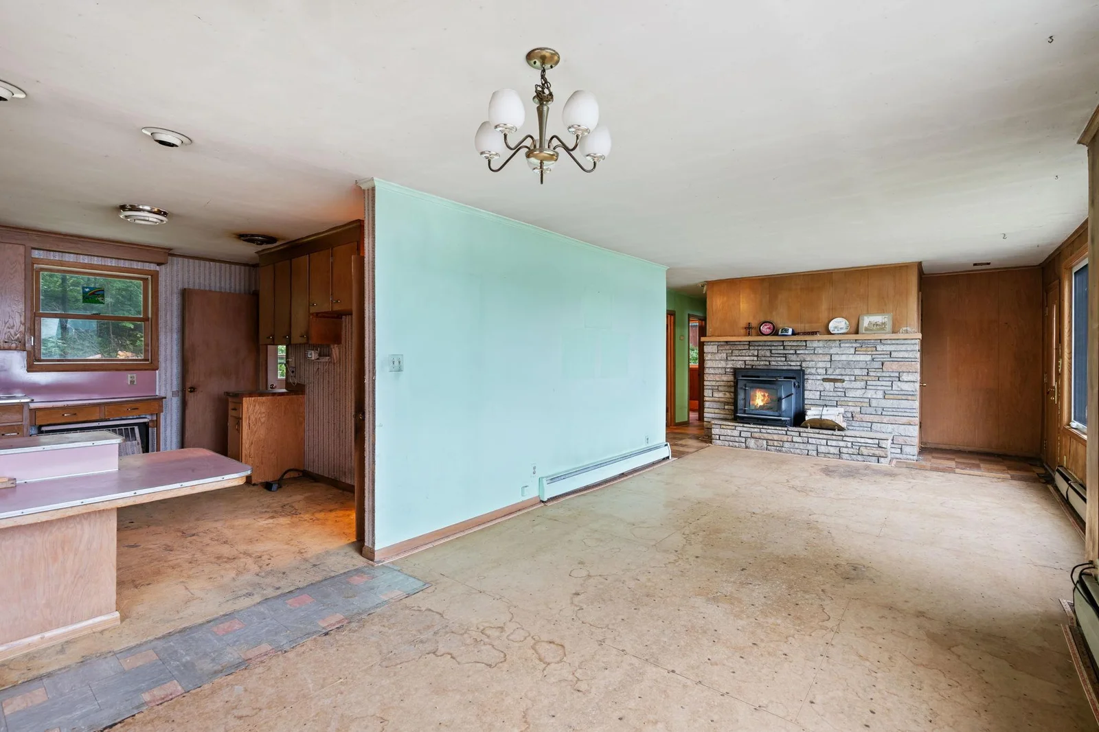 Sunroom looking into Living room with wood burning stove insert