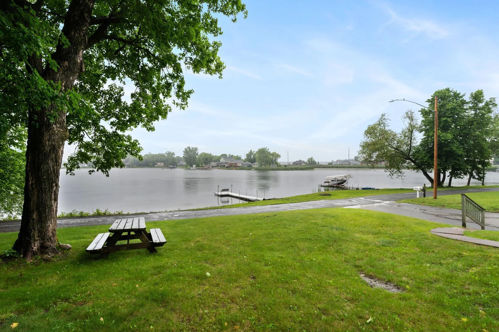 Large front yard with gorgeous West facing lakeviews