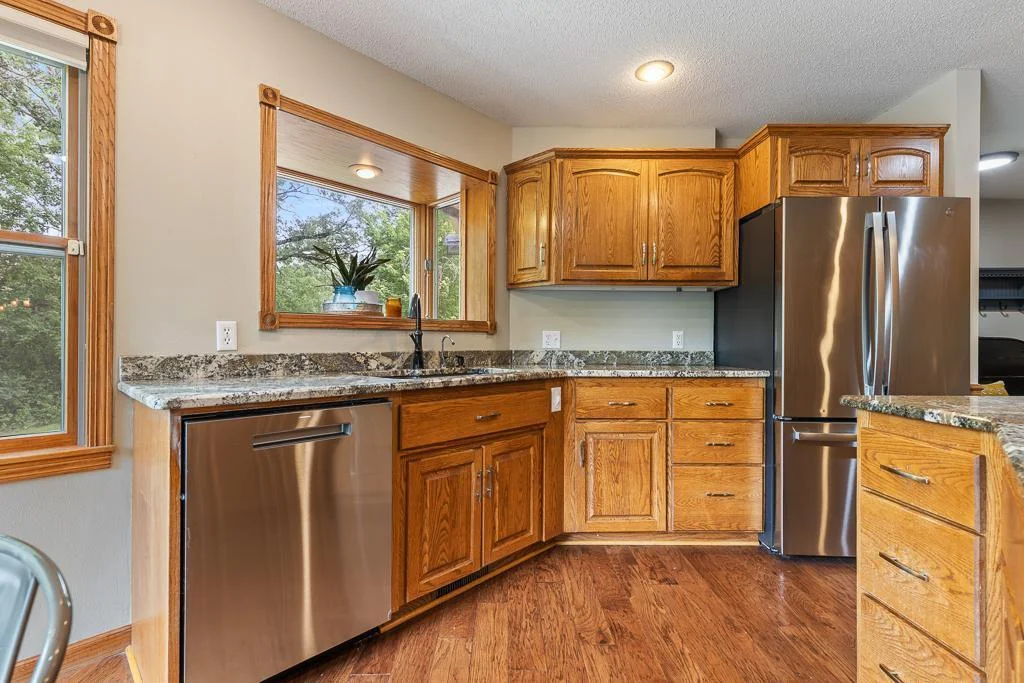 The kitchen bay window is a great feature for decor, plants, and herbs!