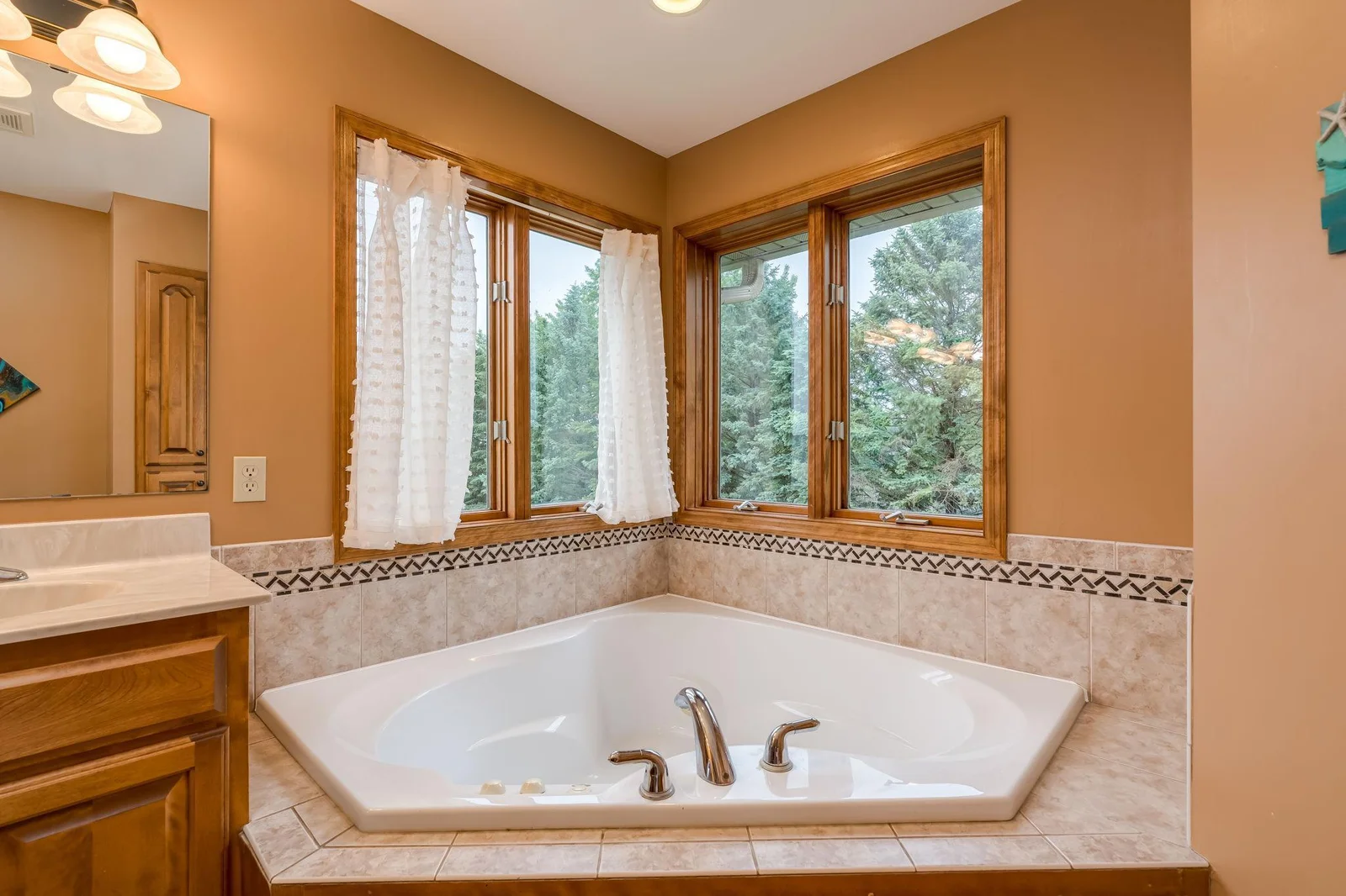 Large corner tub to soak and relax in.