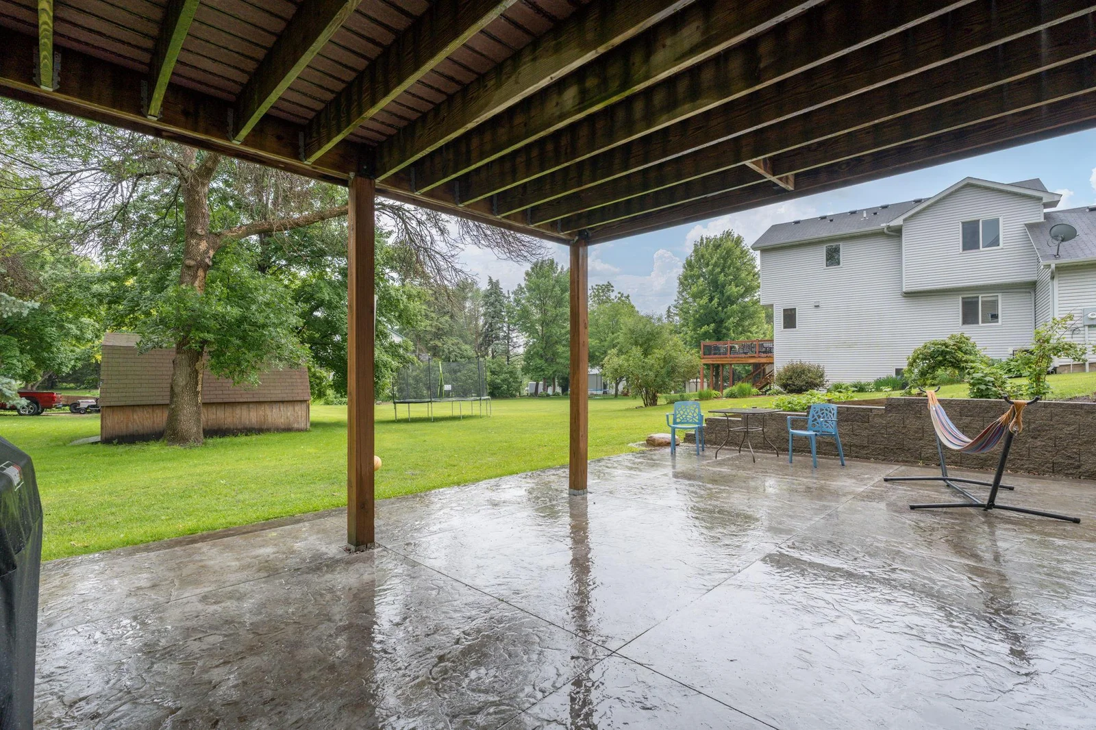 Want a screened porch?  The area under the deck can make it easy and you'll still have a nice patio to relax on! Nice size yard (goes back to the trampoline)